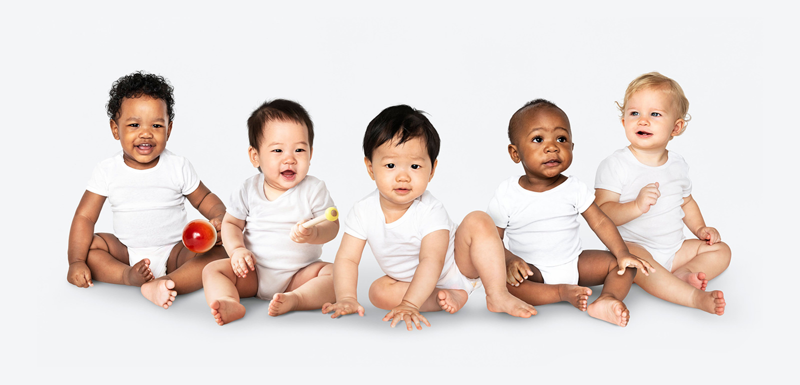 Diverse-babies-sitting-on-the-floor